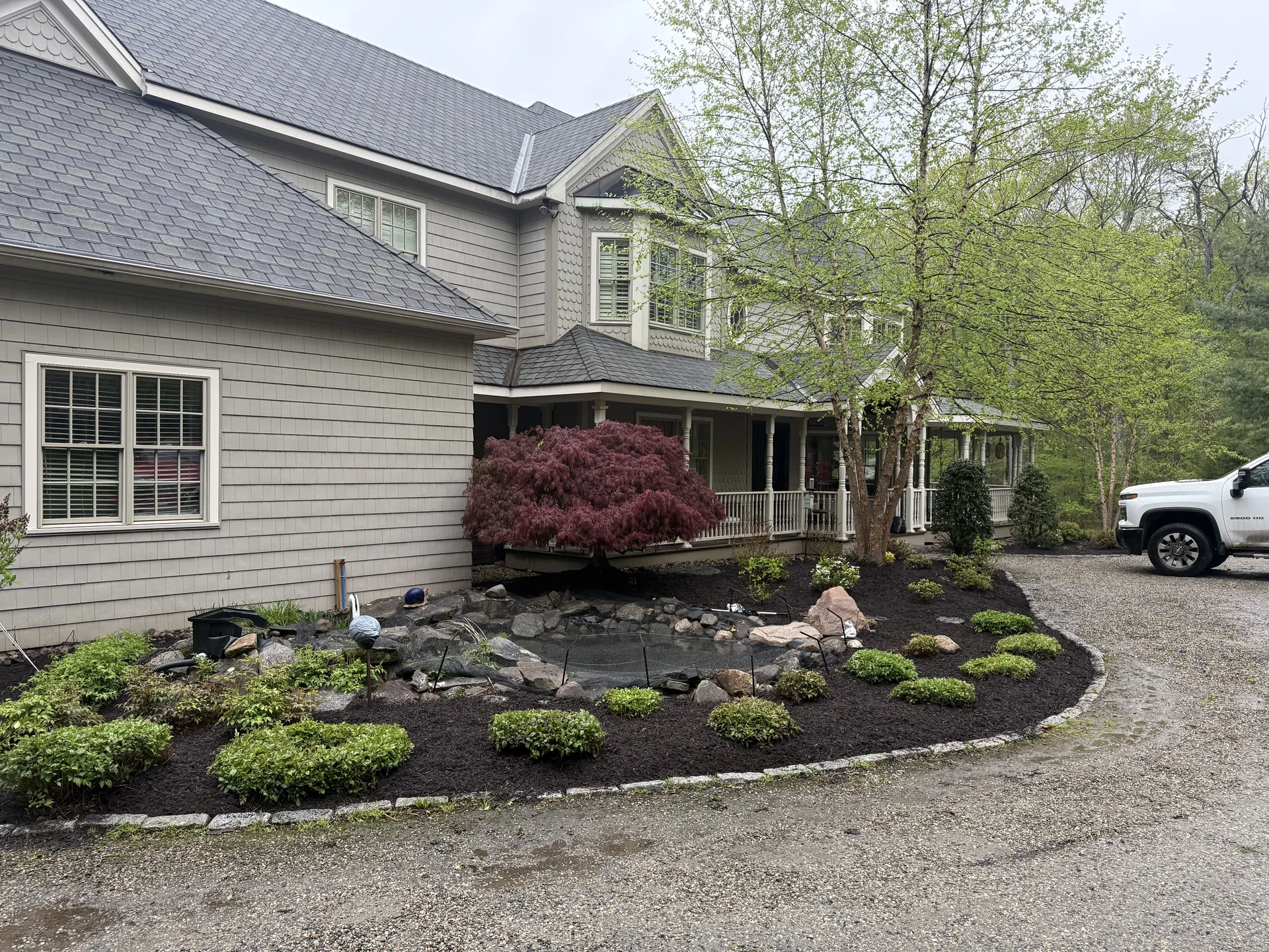 Front entrance landscaping with mulched beds